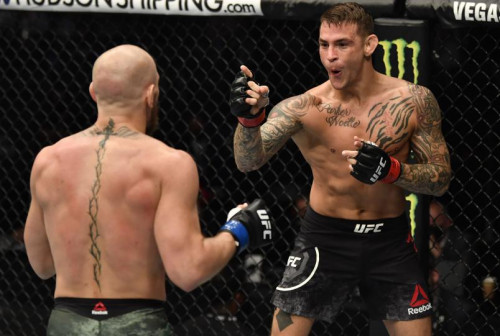 Dustin Poirier points at Conor McGregor of Ireland in a lightweight fight during the UFC 257 event i